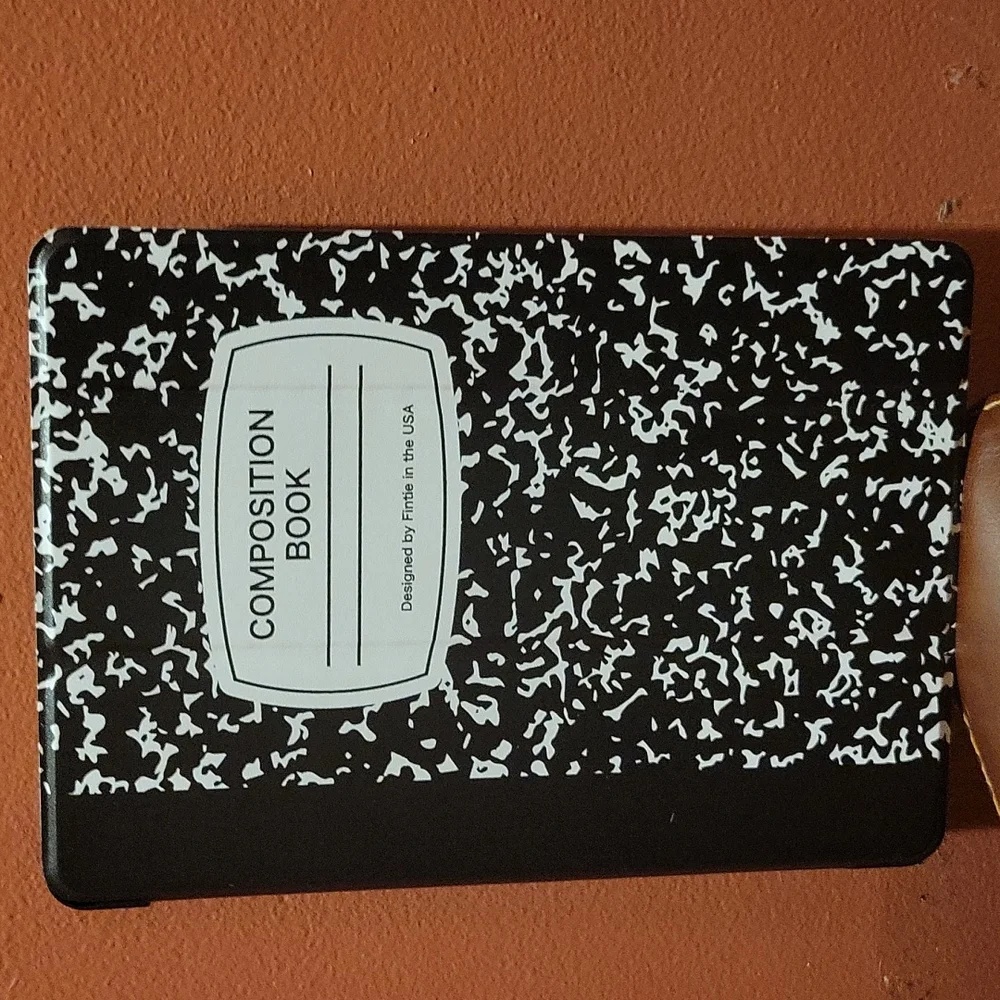 IPad min cover that looks like a school composition book and it black and white